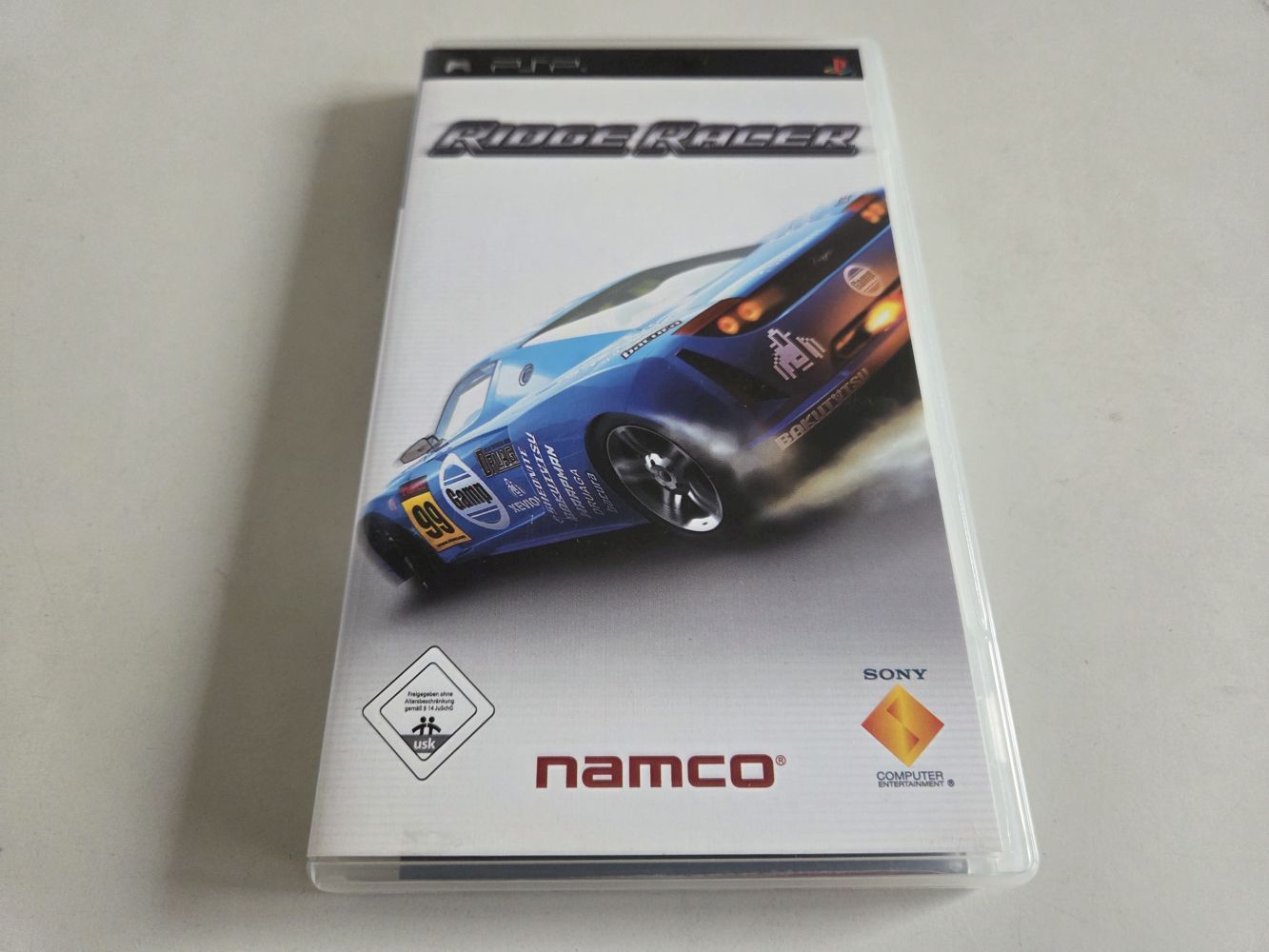 (Bild für) PSP Ridge Racer - zum Schließen ins Bild klicken